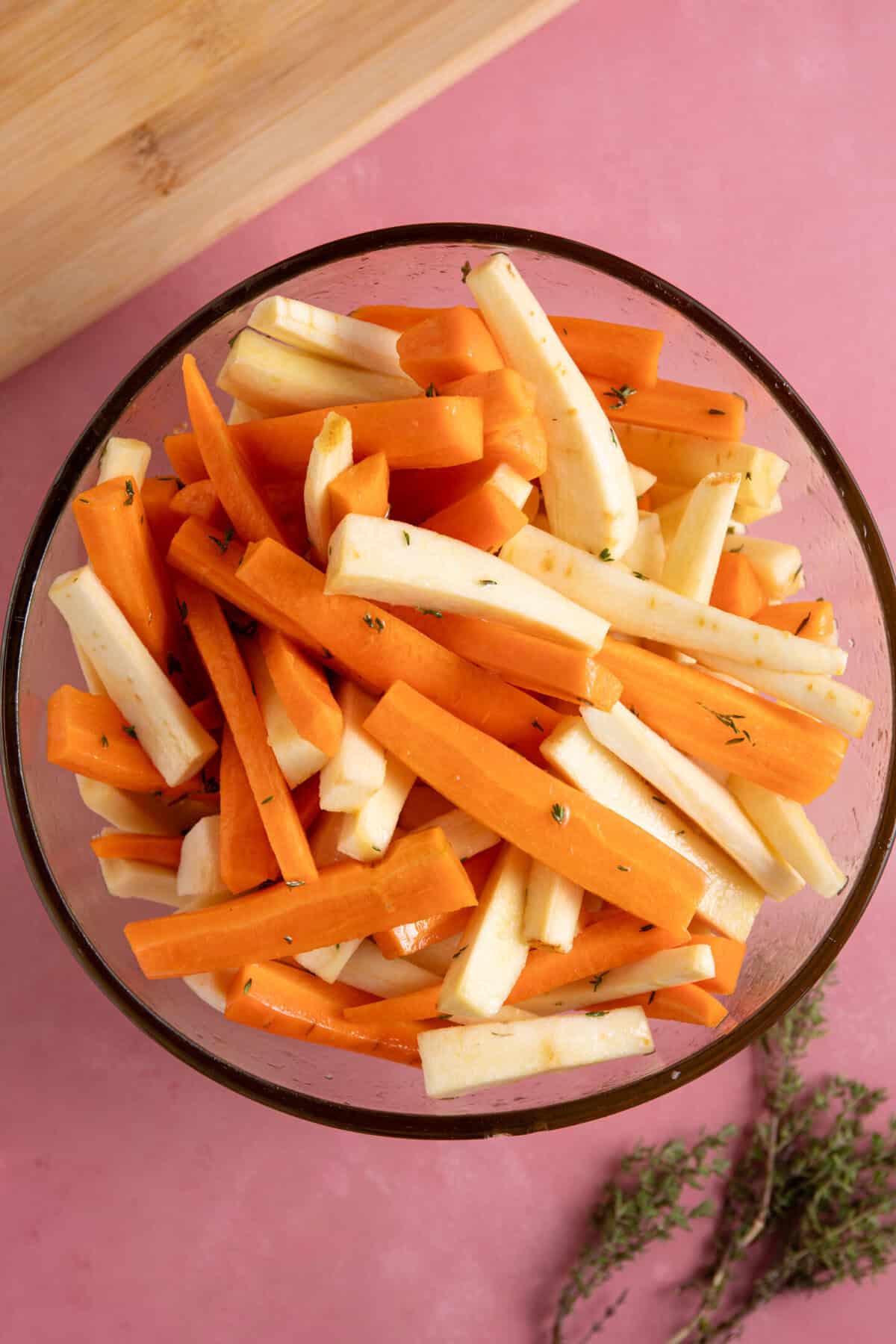 Marinade the carrots and parsnips in the honey, olive oil, thyme and vinegar.