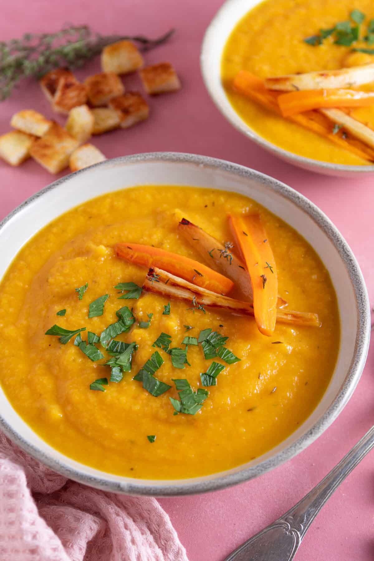 A bowl of roasted carrot and parsnip soup.