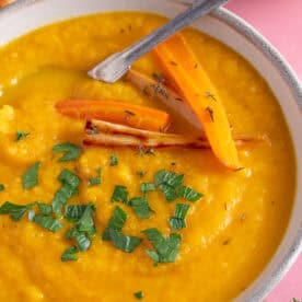 A bowl of roasted carrot and parsnip soup.