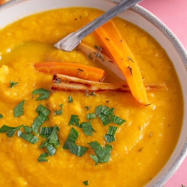 A bowl of roasted carrot and parsnip soup.