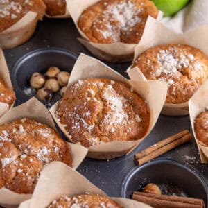 Gluten free apple muffins on a baking tray.