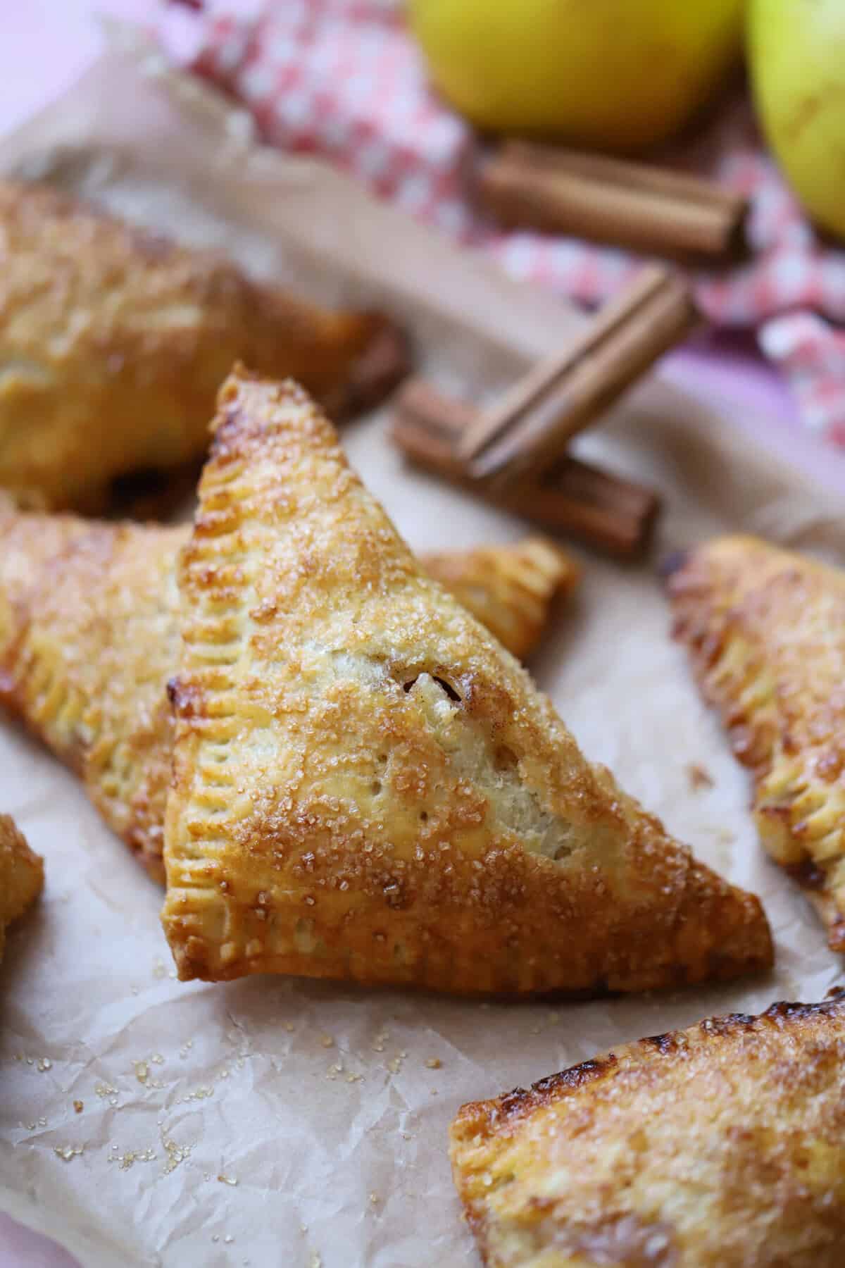 A tray full of gluten free apple turnovers.