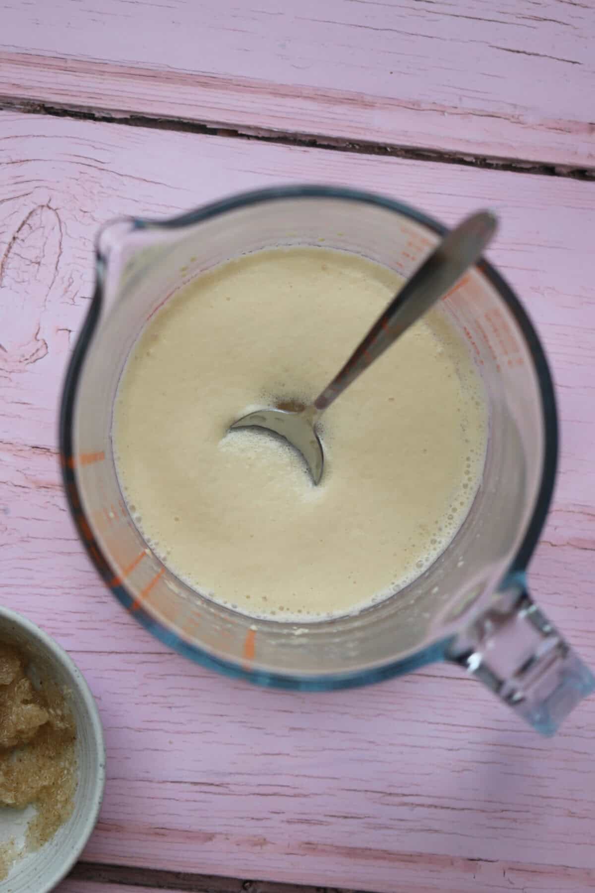 Activate the yeast in warm water until it forms a frothy head.