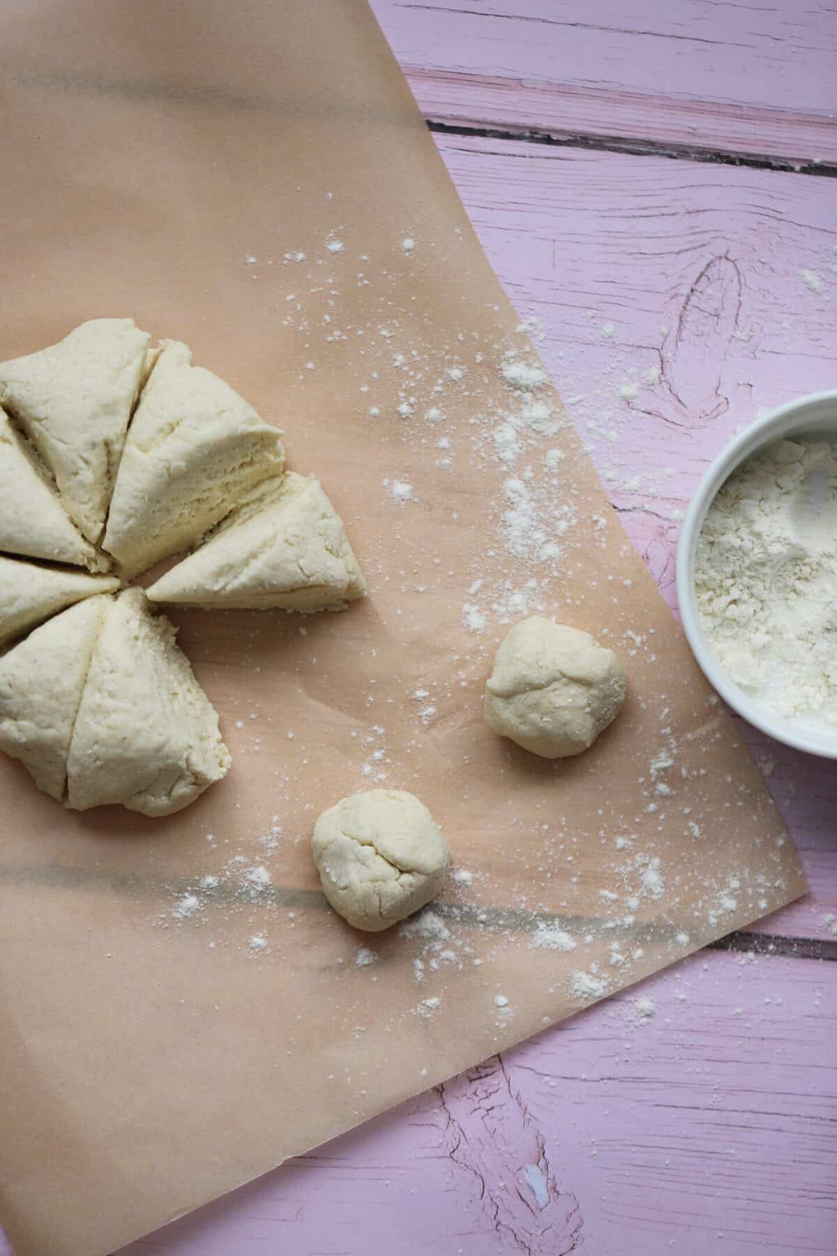 Divide the gluten free dough into 16 equal-sized pieces and roll into balls.