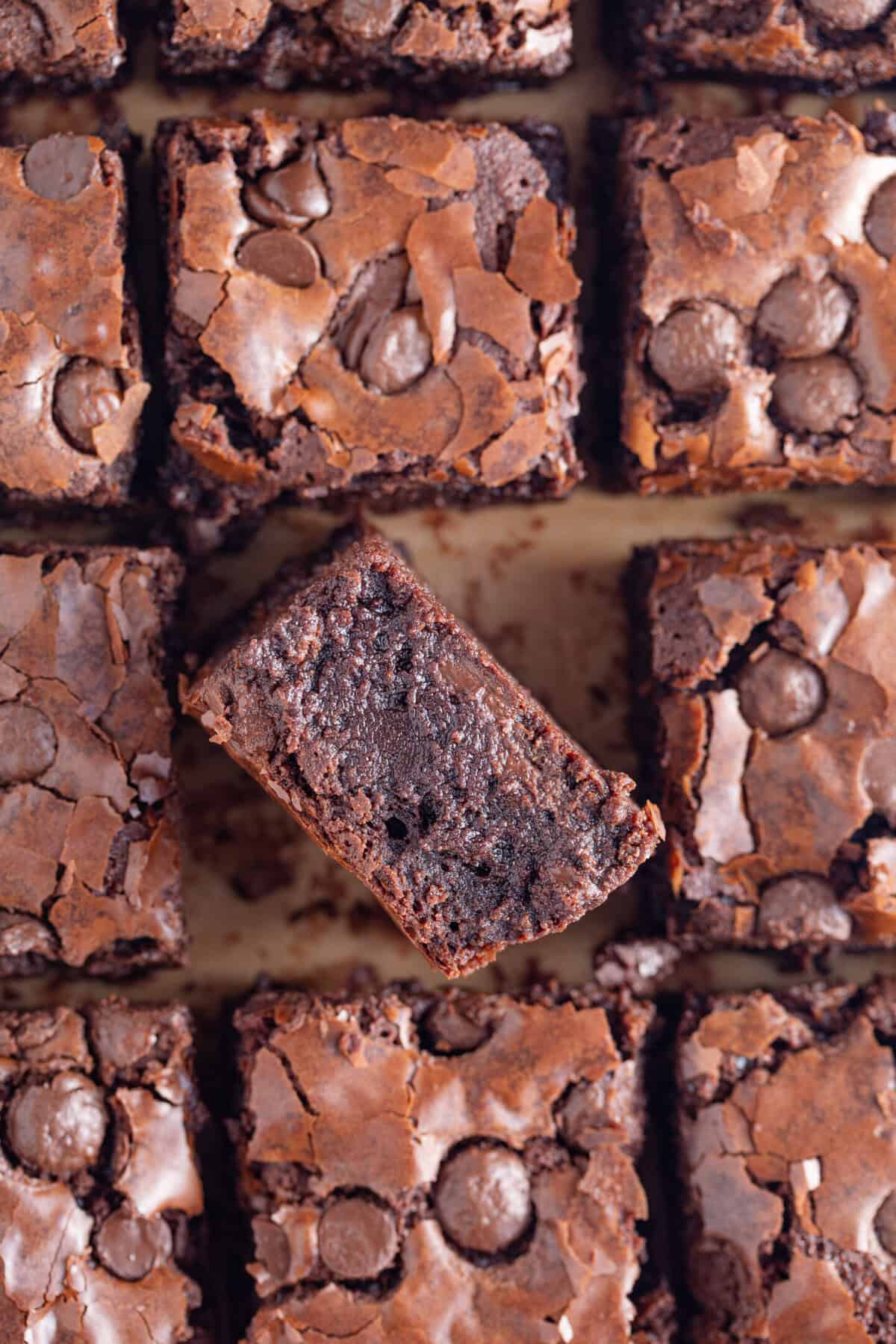 Gluten free brownies on a sheet of baking paper.