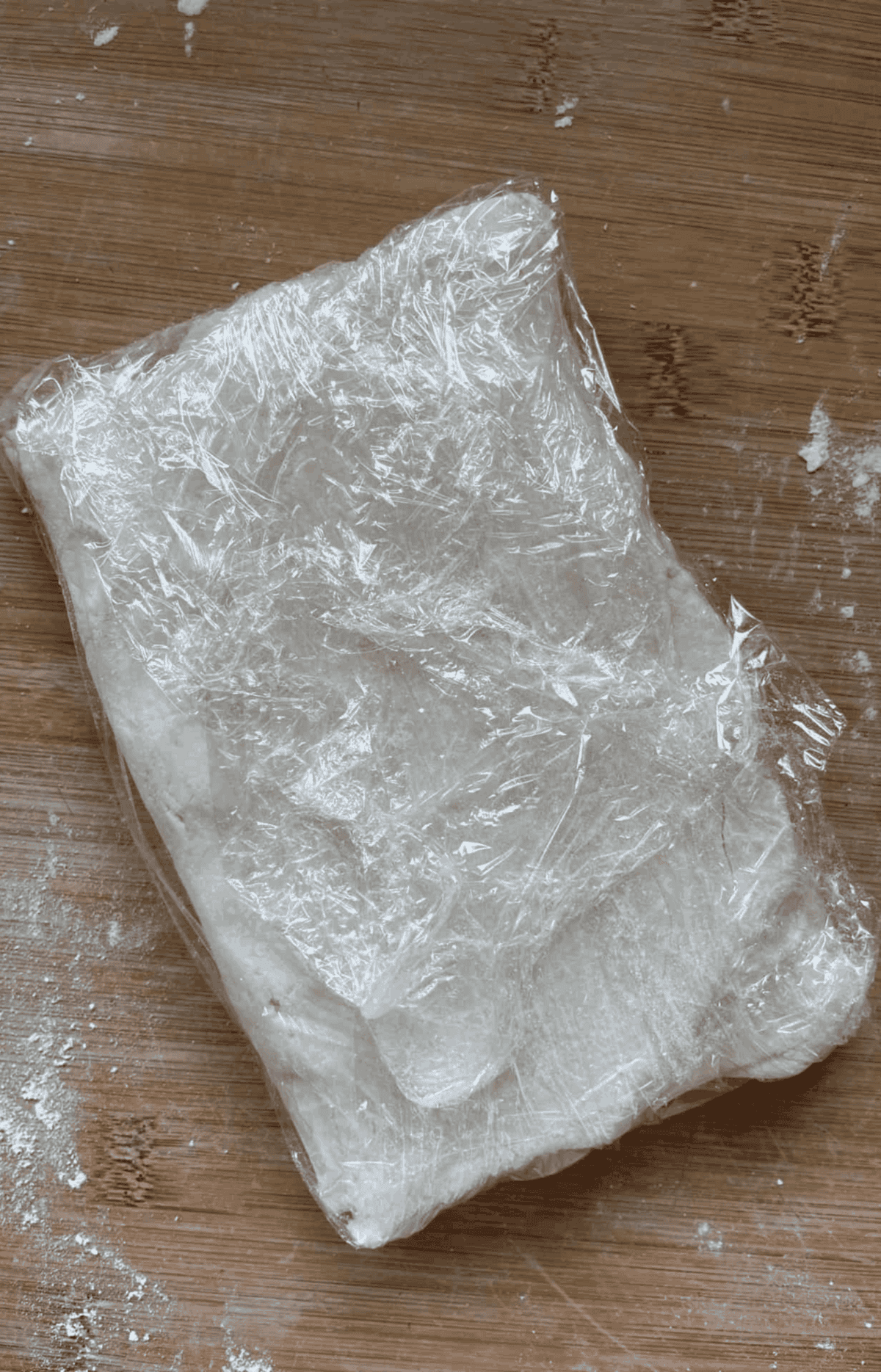 Gluten free puff pastry wrapped in clingfilm.