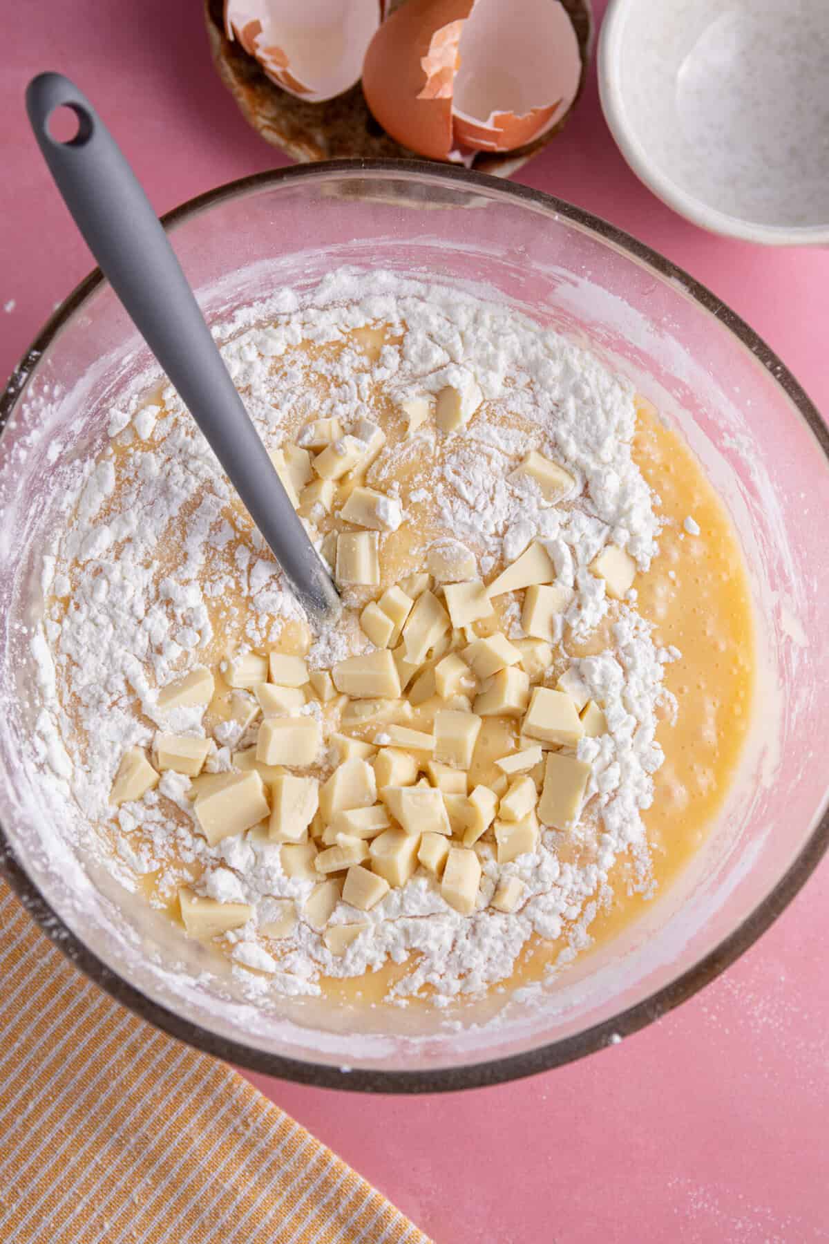 Fold through the gluten free flour and white chocolate chunks.
