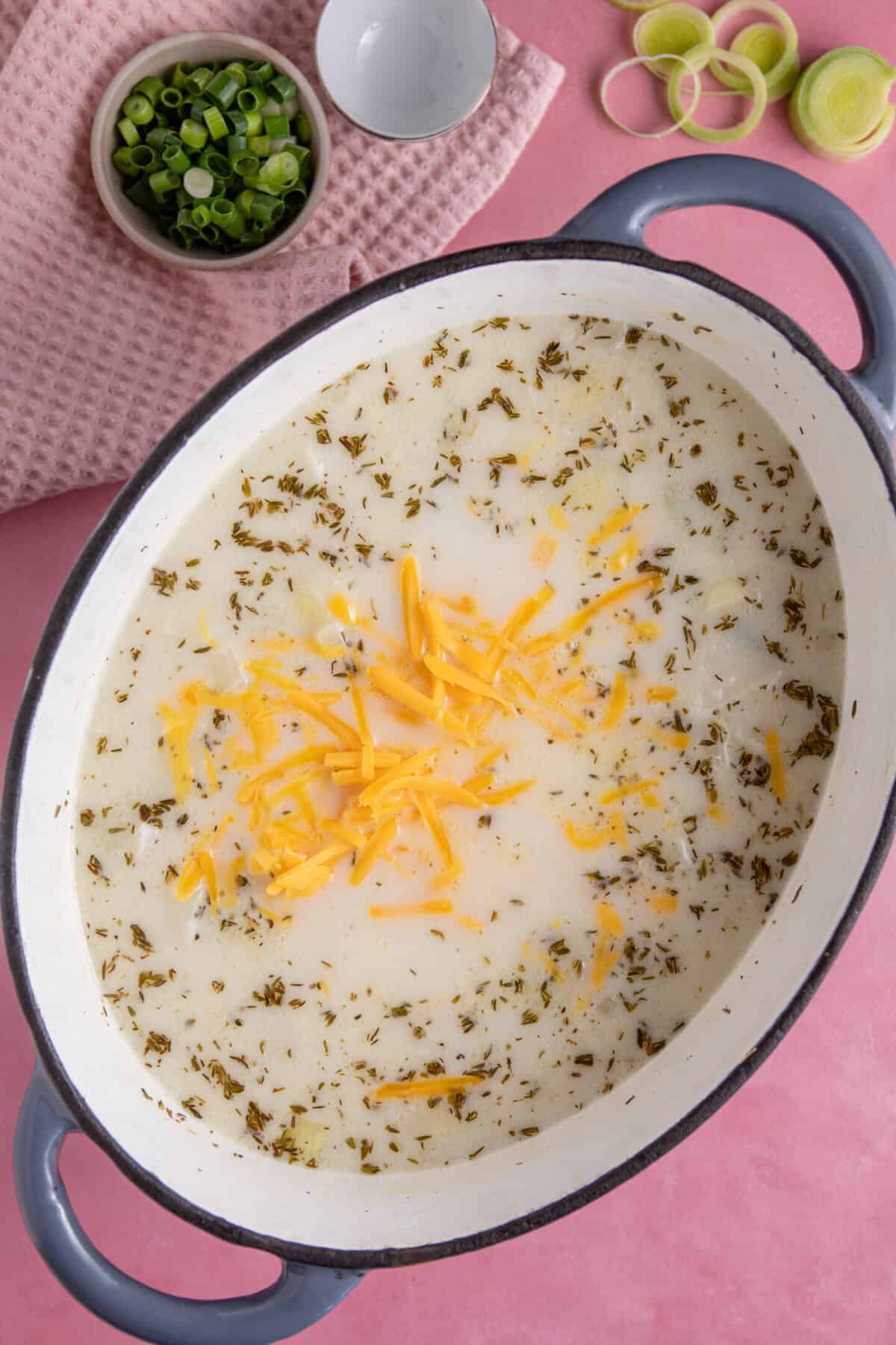 Add the cheese to the soup and stir until melted.