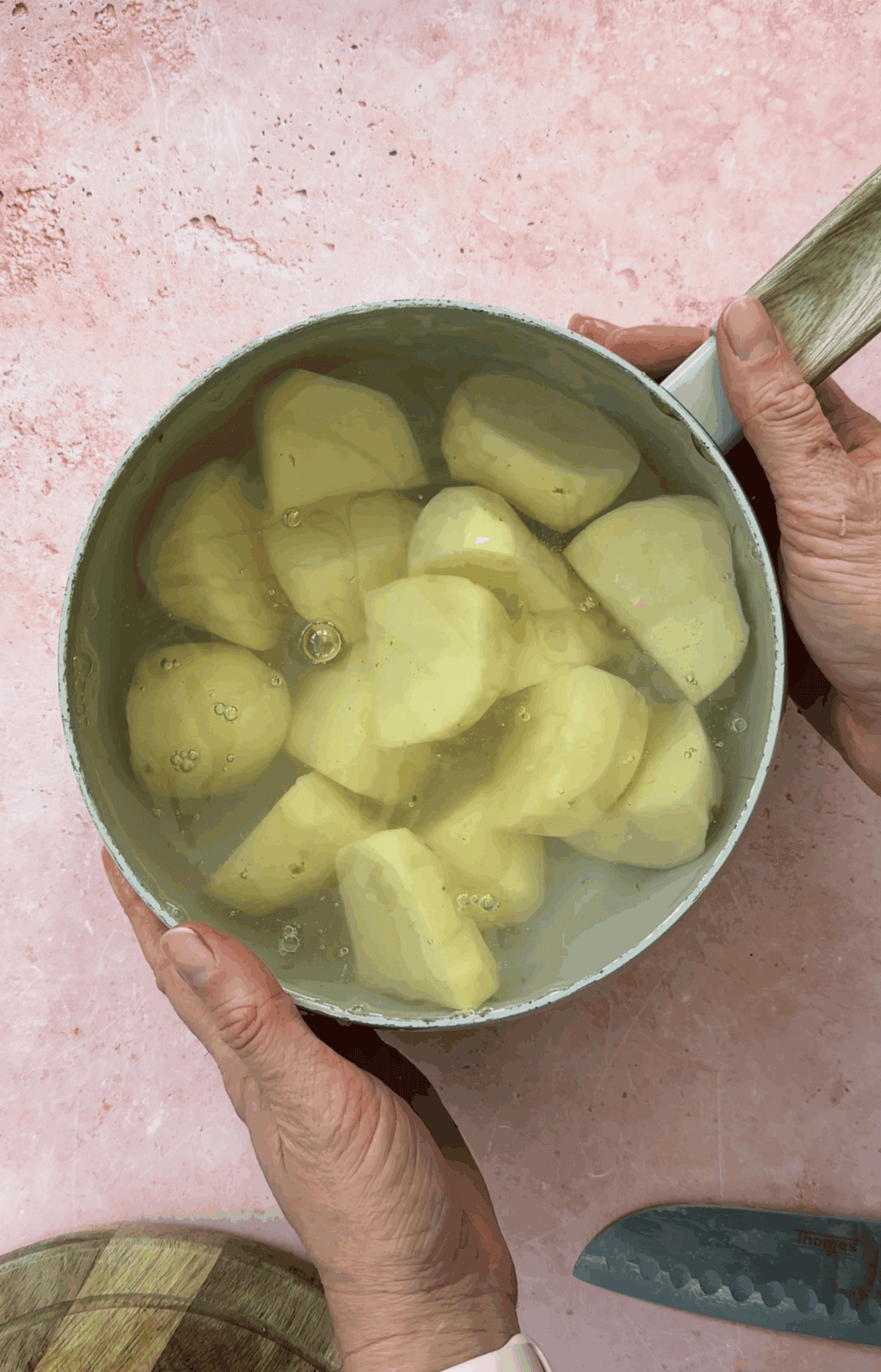 Peel and chop the potatoes then par-boil them.