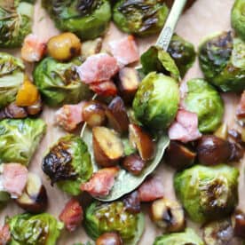 A tray of sprouts, bacon and chestnuts.