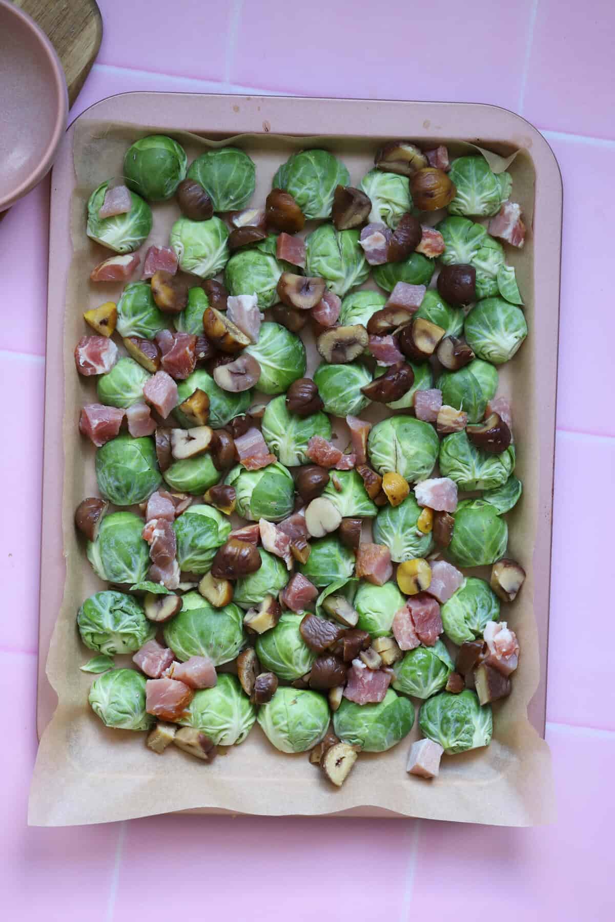 Sprinkle over the chestnuts and bacon then drizzle with olive oil.