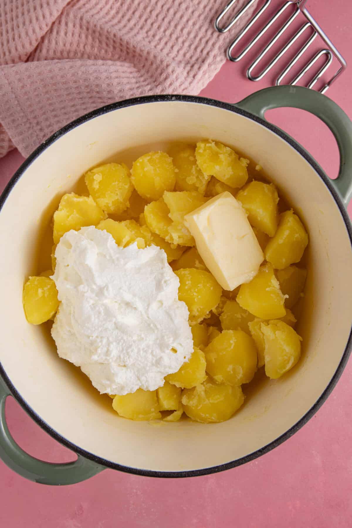 Add the whipped cottage cheese and butter to the potatoes.