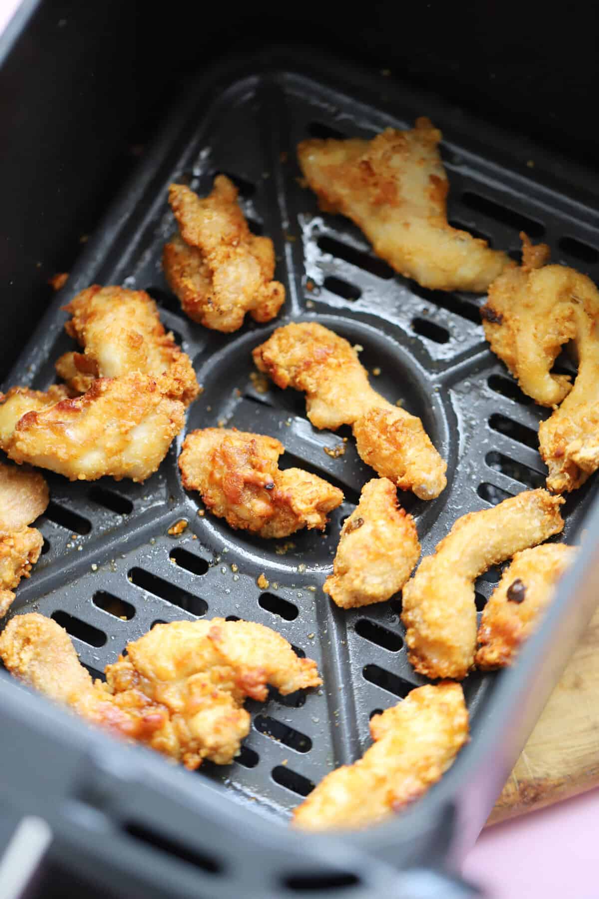 Air fry the chicken until crispy then top with sweet chilli sauce to serve.