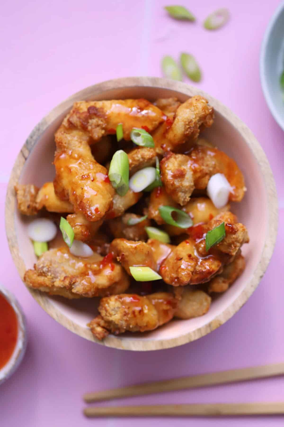 A bowl of air fryer crispy chilli chicken.