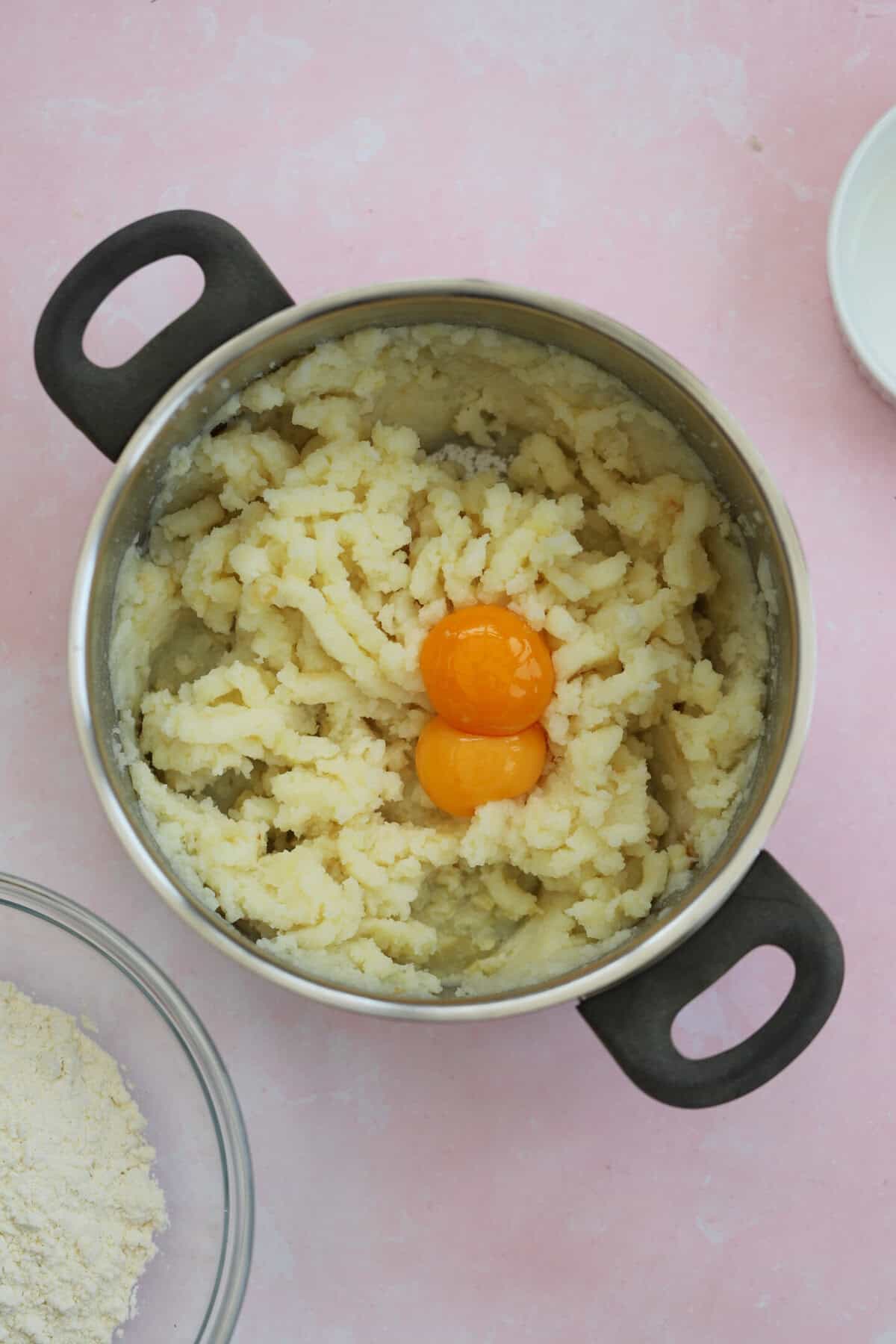 Add the egg yolks to the mashed potato and mix well.