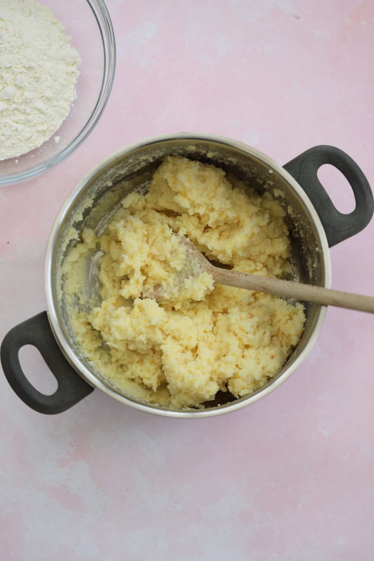 Mix the potato and egg yolks together until they form a sticky dough.