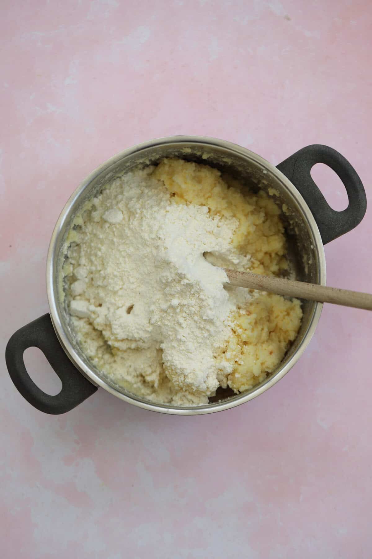 Mix the gluten free flour blend into the egg and potato mixture.