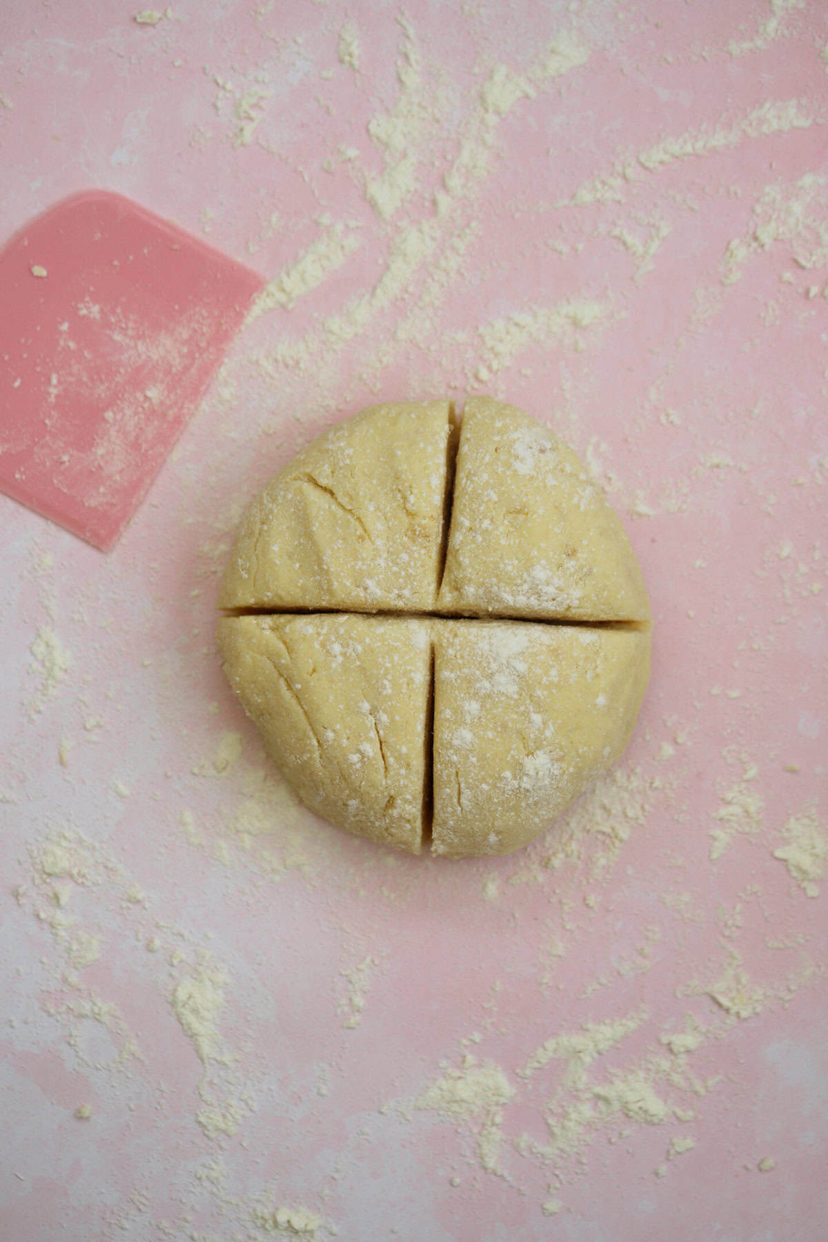 Separate the gnocchi dough into four equal-sized pieces.