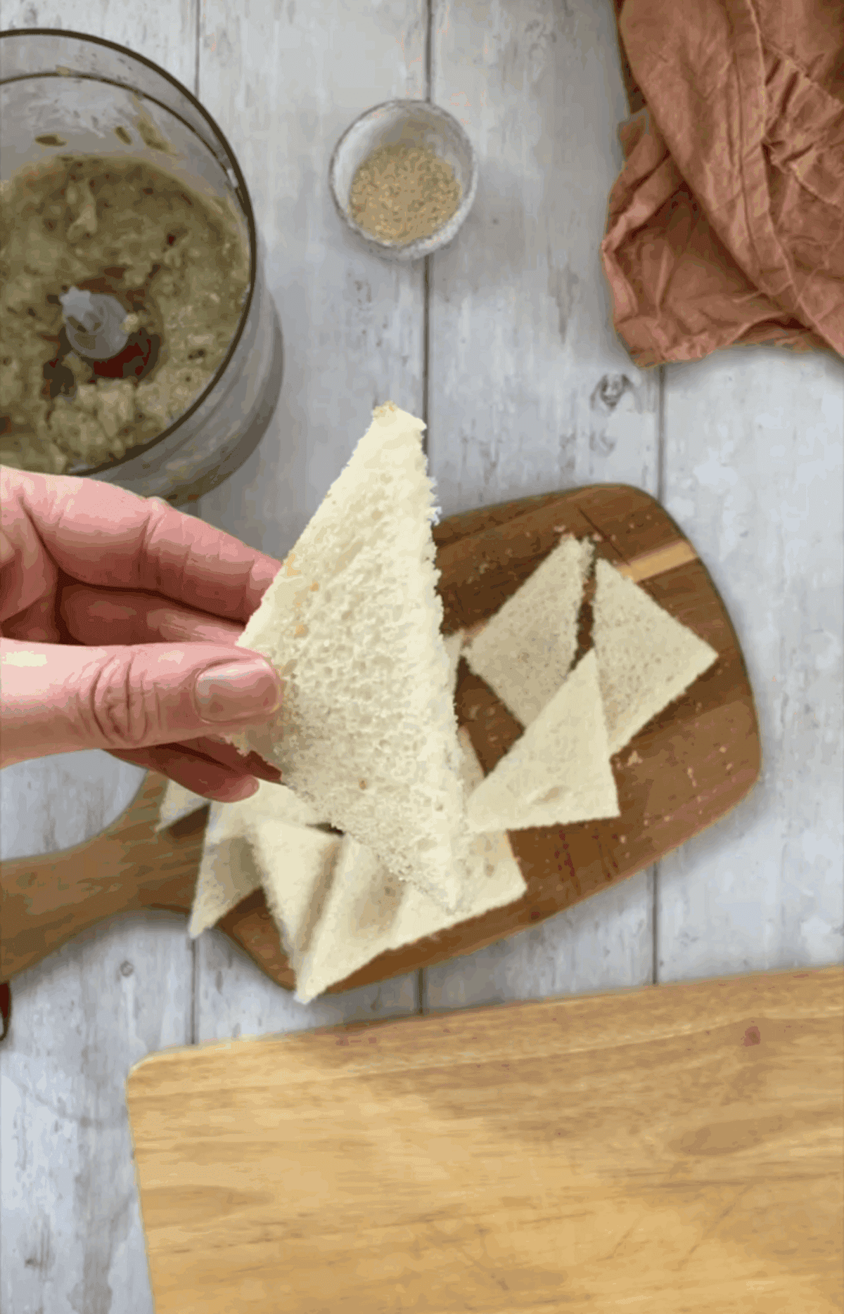 Cut the crusts off the gluten free bread then cut into triangles.