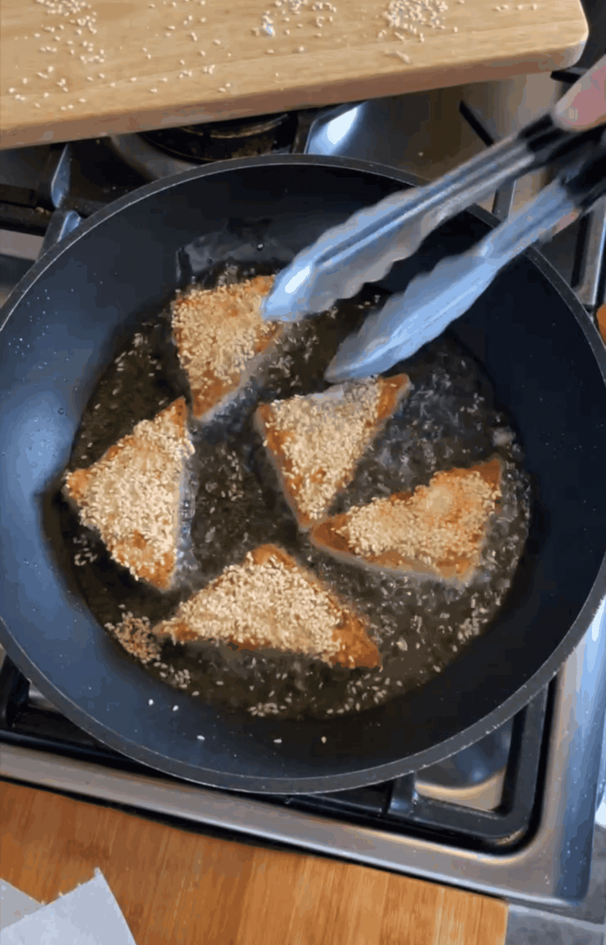 Flip the prawn toast and fry the other side before serving.
