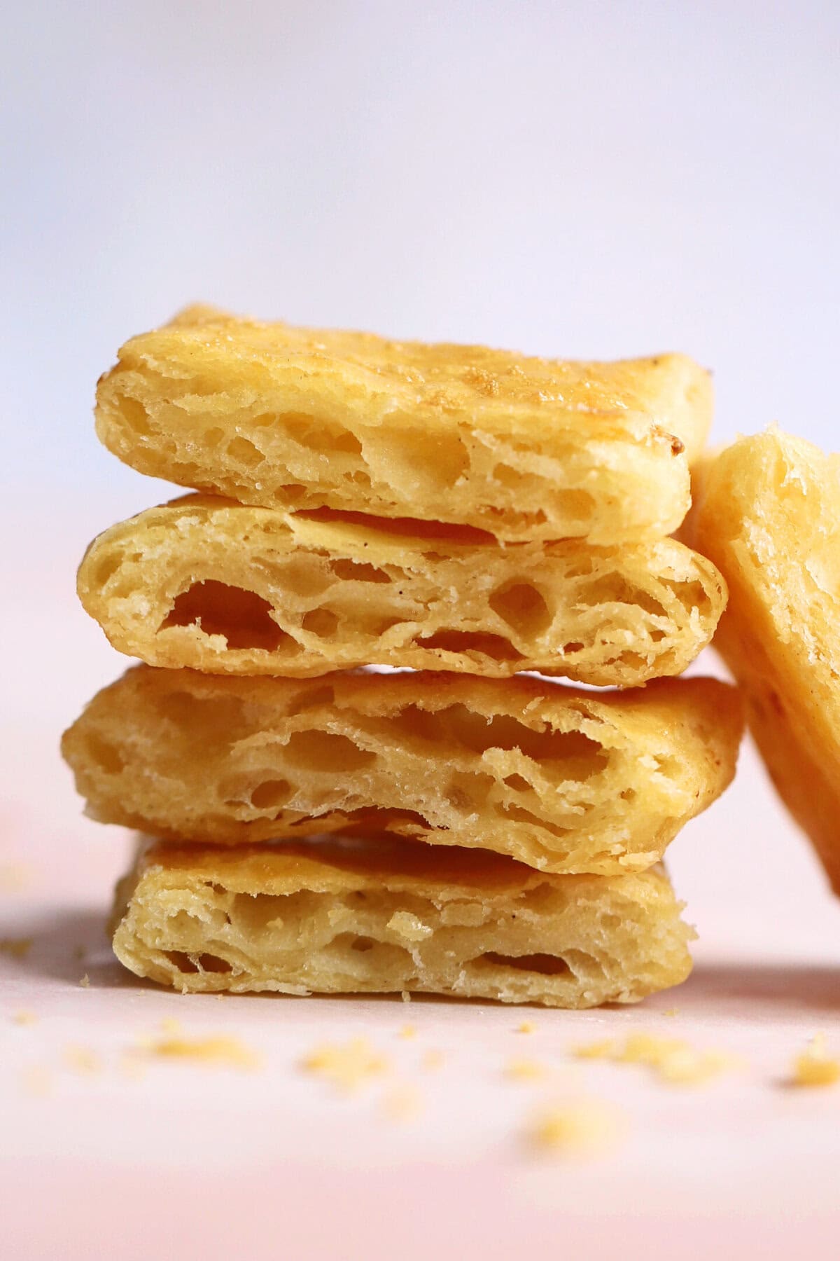 A stack of gluten free puff pastry slices showing the layers.