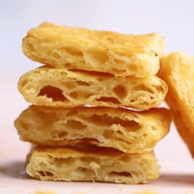 A stack of gluten free puff pastry slices showing the layers.