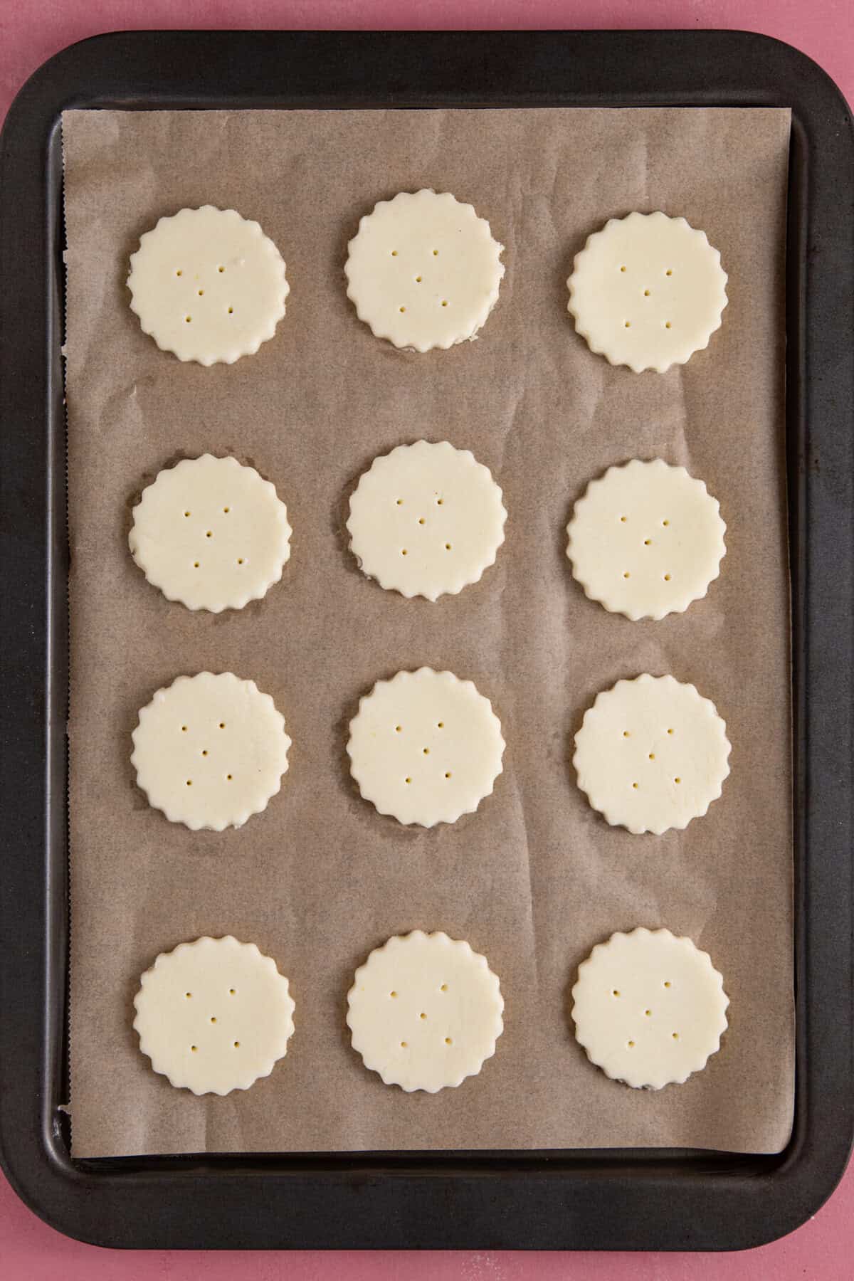 Place the crackers on a baking tray and bake until golden.