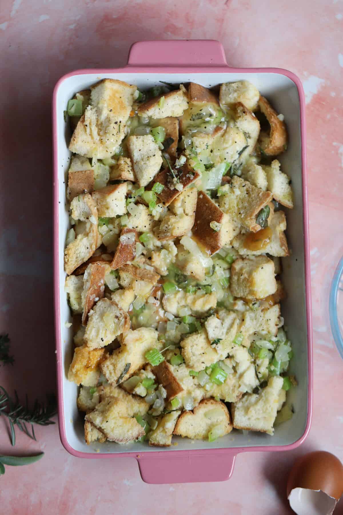 Add to the baking dish and pour over the rest of the stock and egg mixed together.