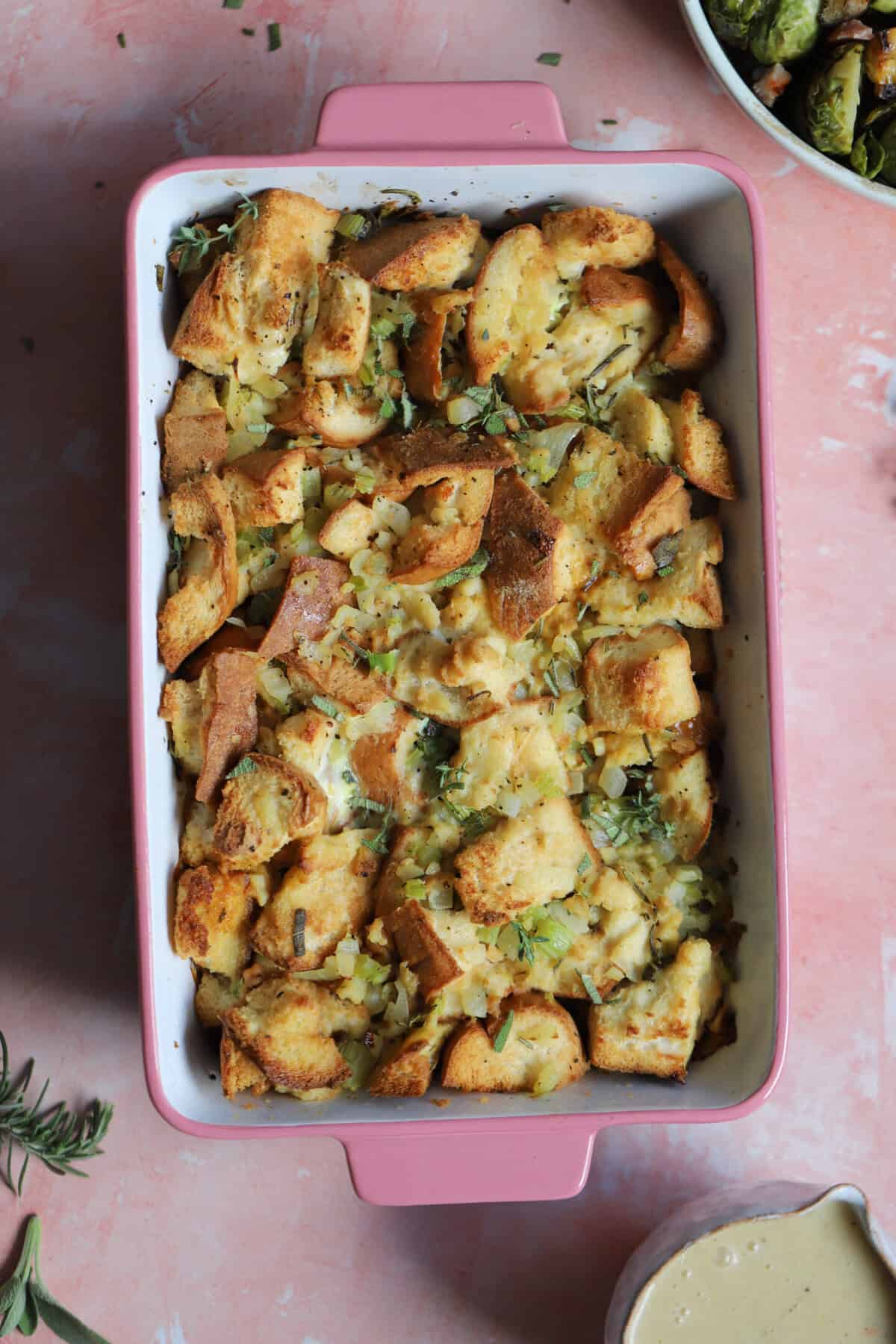 A baking tray filled with gluten free Thanksgiving stuffing.