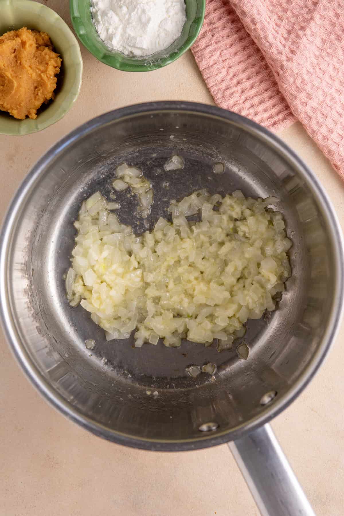Fry the onion and garlic in the butter over a low heat.