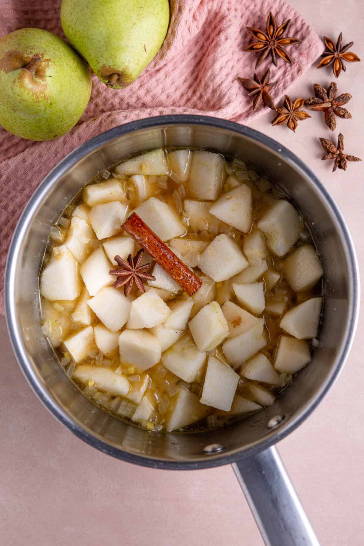 Add the chopped pear, spices, sugar and vinegar to the pan and simmer.