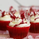 Gluten free cupcakes with cream cheese frosting, edible broken glass and edible blood on top.