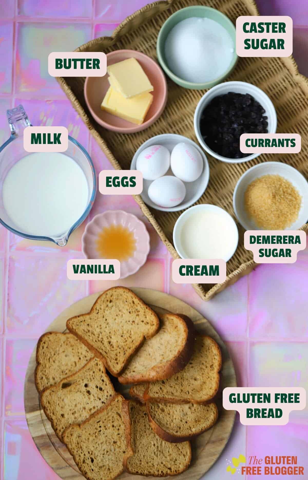 Ingredients for gluten free bread and butter pudding including bread, milk, cream, eggs, butter, fruit and vanilla extract.