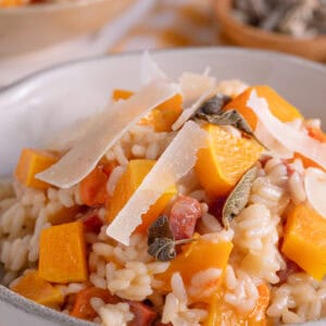 A bowl of butternut squash and chorizo risotto with sage and parmesan.