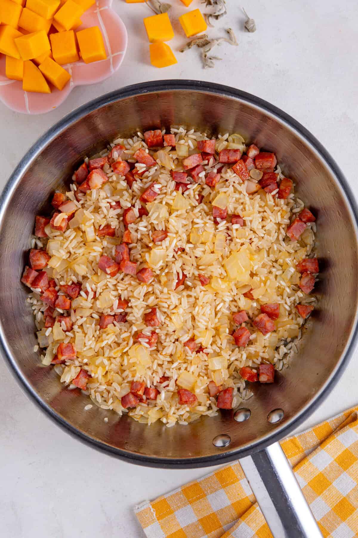 Add the rice to the pan and mix well.