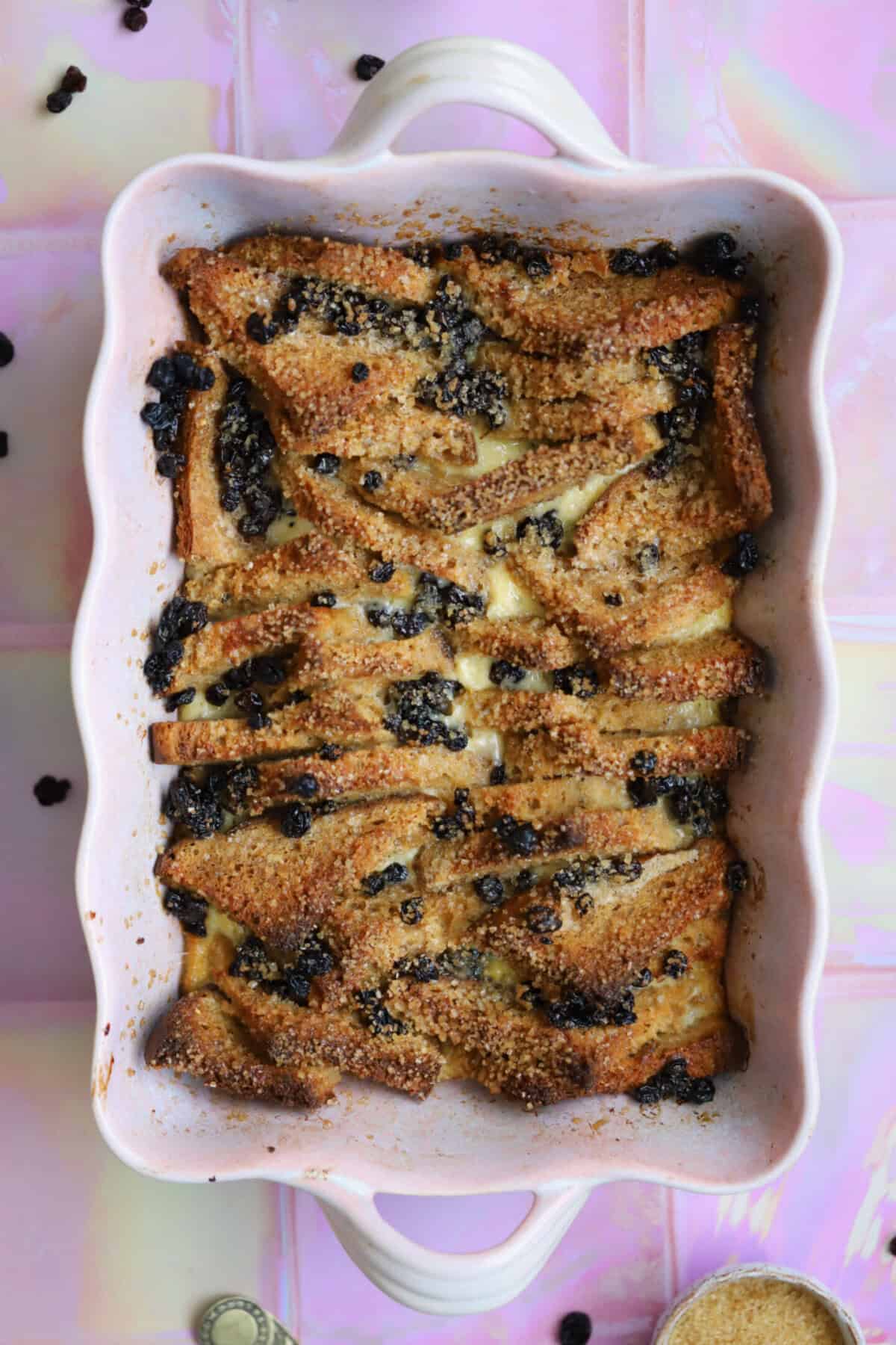 Bake the bread and butter pudding until golden, and serve warm.