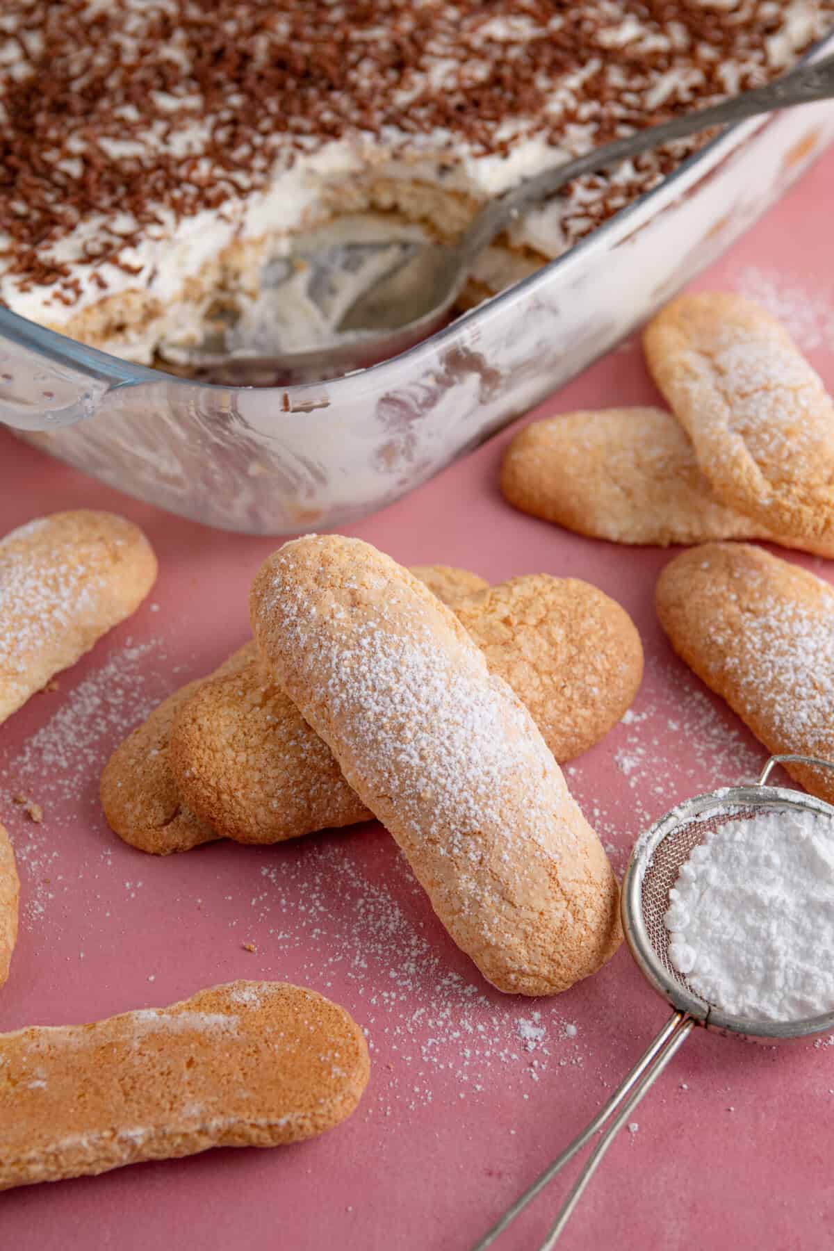 Gluten free lady fingers being used to make a tiramisu.