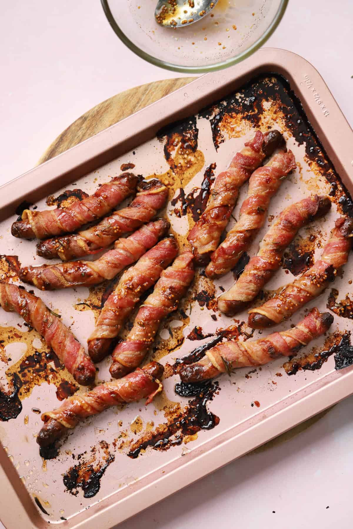 Mix up the marinade, pour over the pigs in blankets and toss to coat.