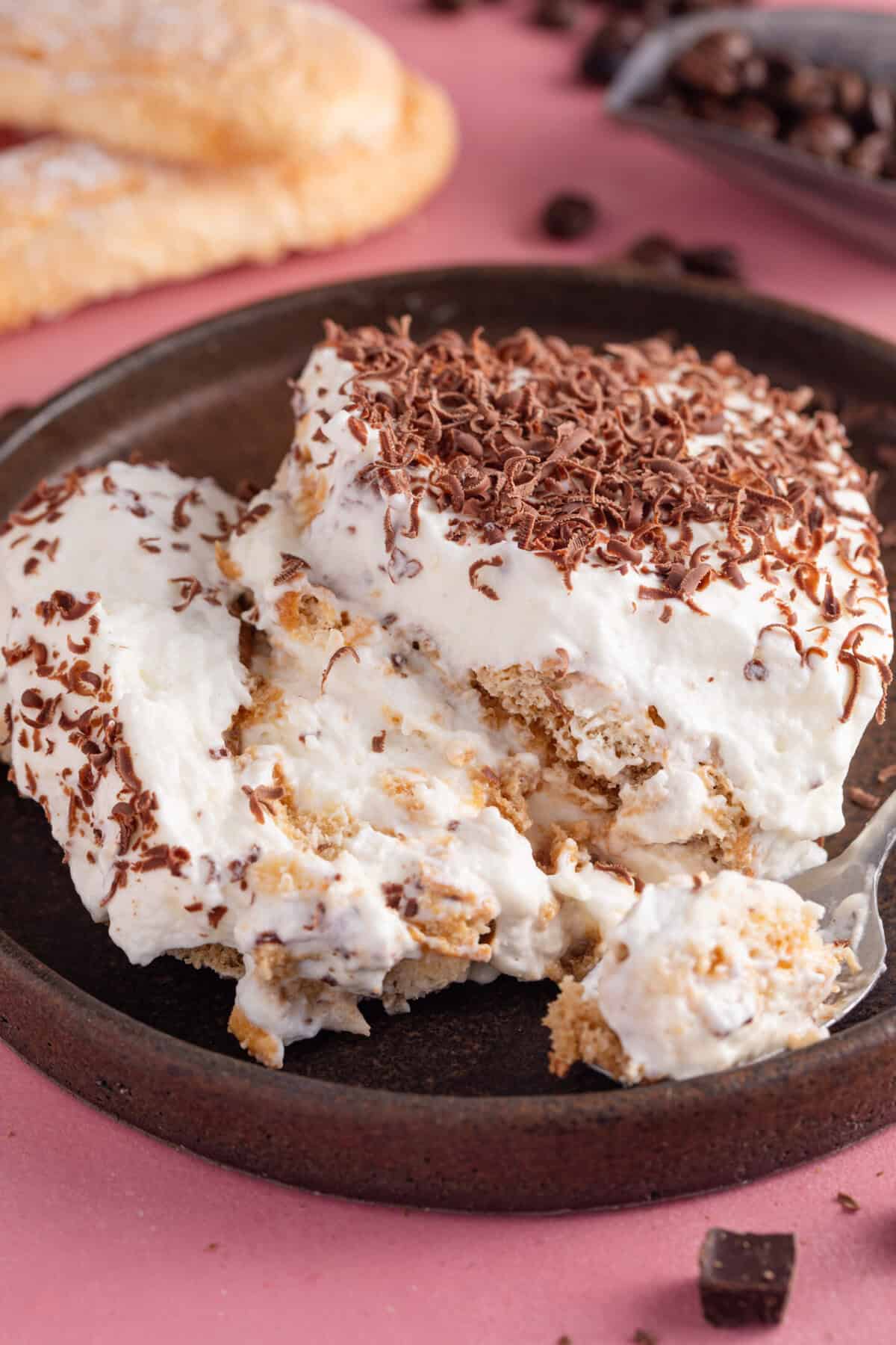 A portion of gluten free tiramisu on a plate ready to eat.