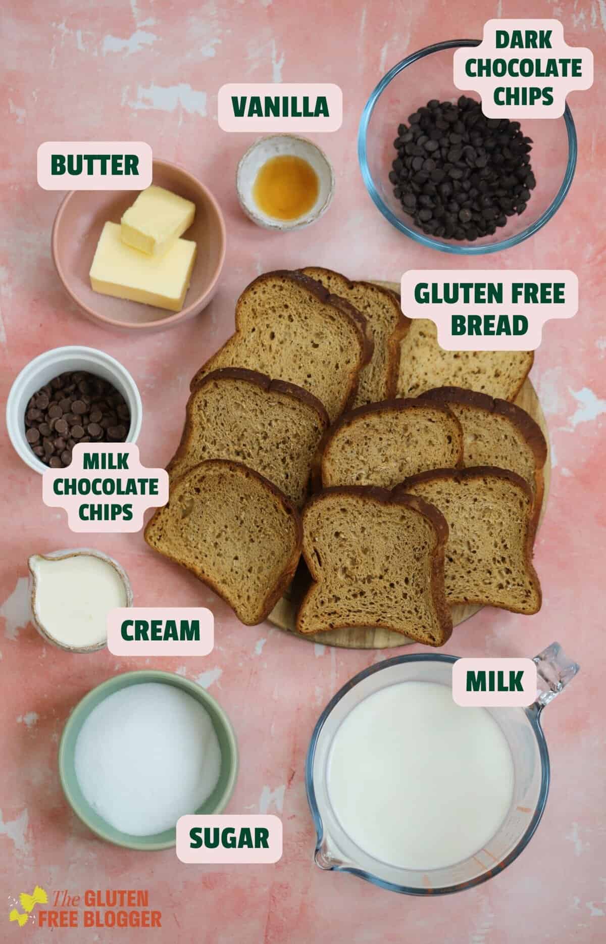 Ingredients for a chocolate bread and butter pudding including bread, milk, cream, eggs and chocolate.
