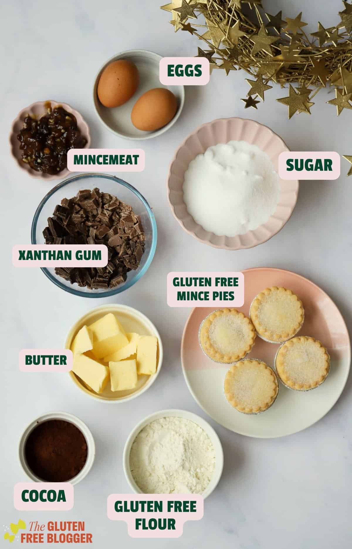 Ingredients for mince pie brownies including chocolate, butter, flour and mince pies.