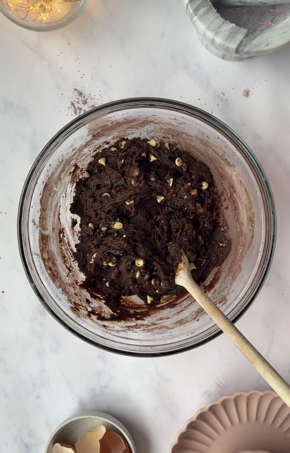 Mix together the cookie dough then chill in the freezer before rolling into balls.