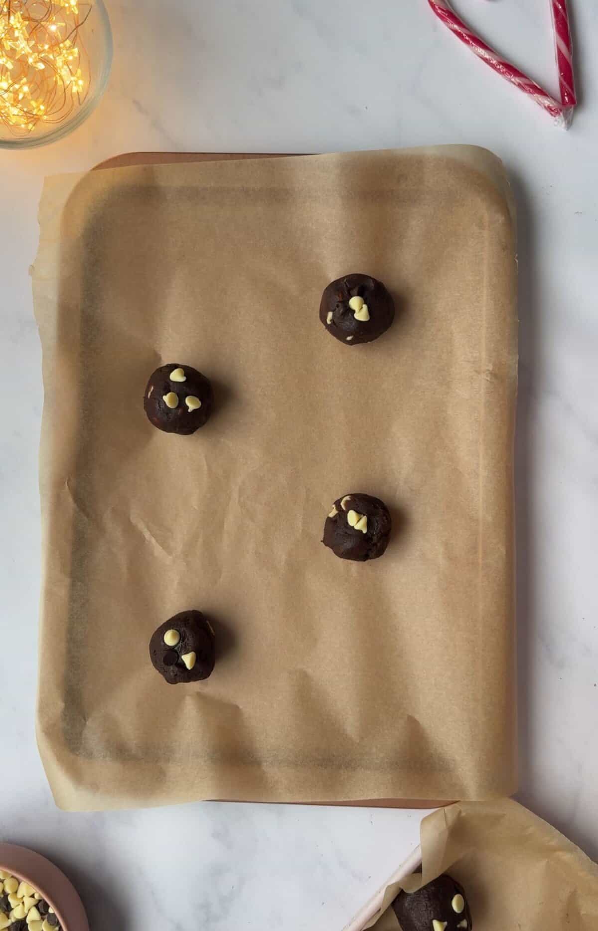 Space the balls of dough out on the baking trays to ensure they don't spread.
