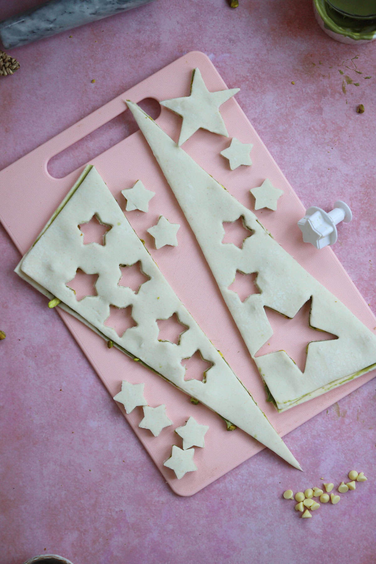 Cut star shapes from the pastry offcuts to decorate your tree.