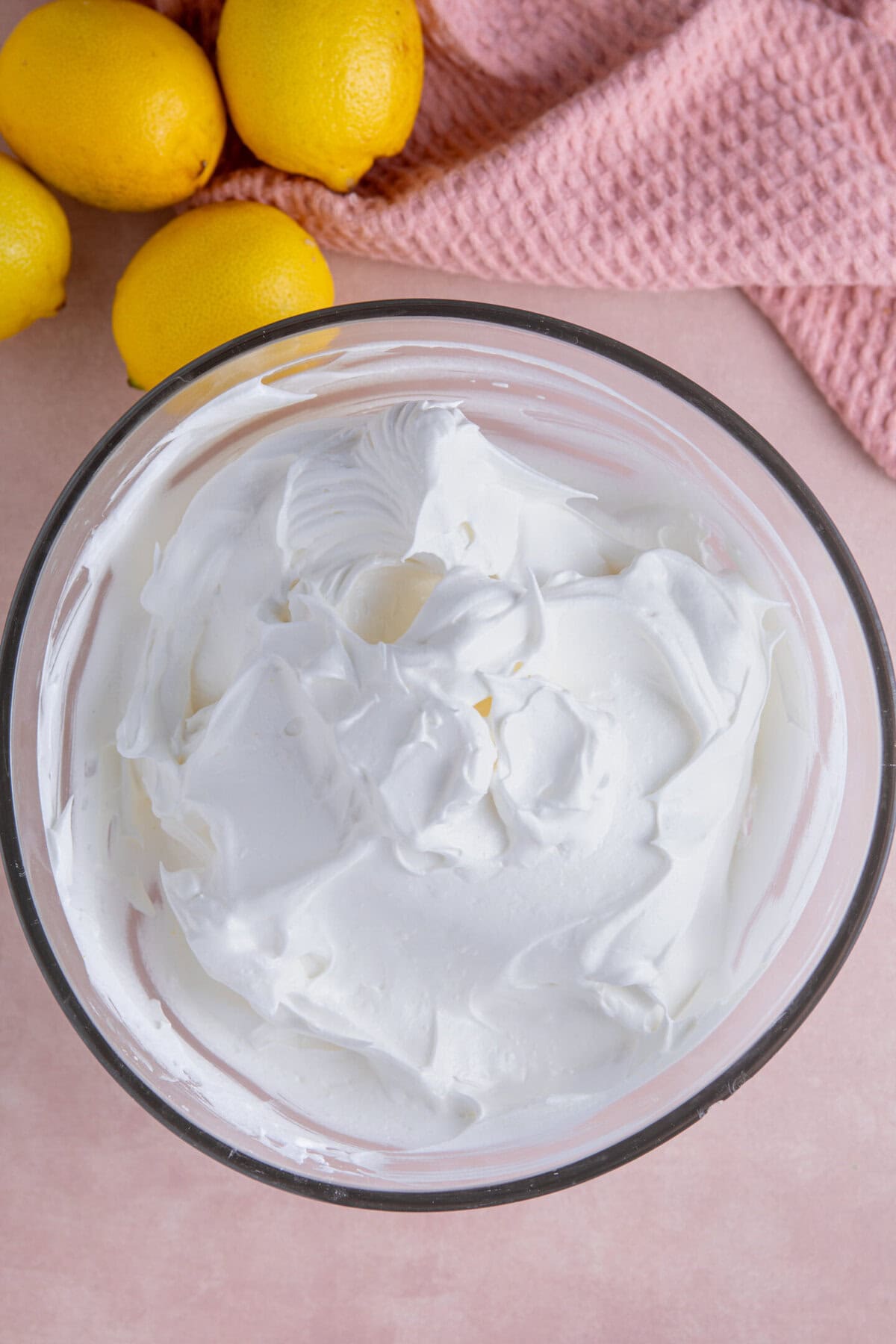 Process shot of a gluten free lemon meringue pie recipe showing the meringue in a bowl.