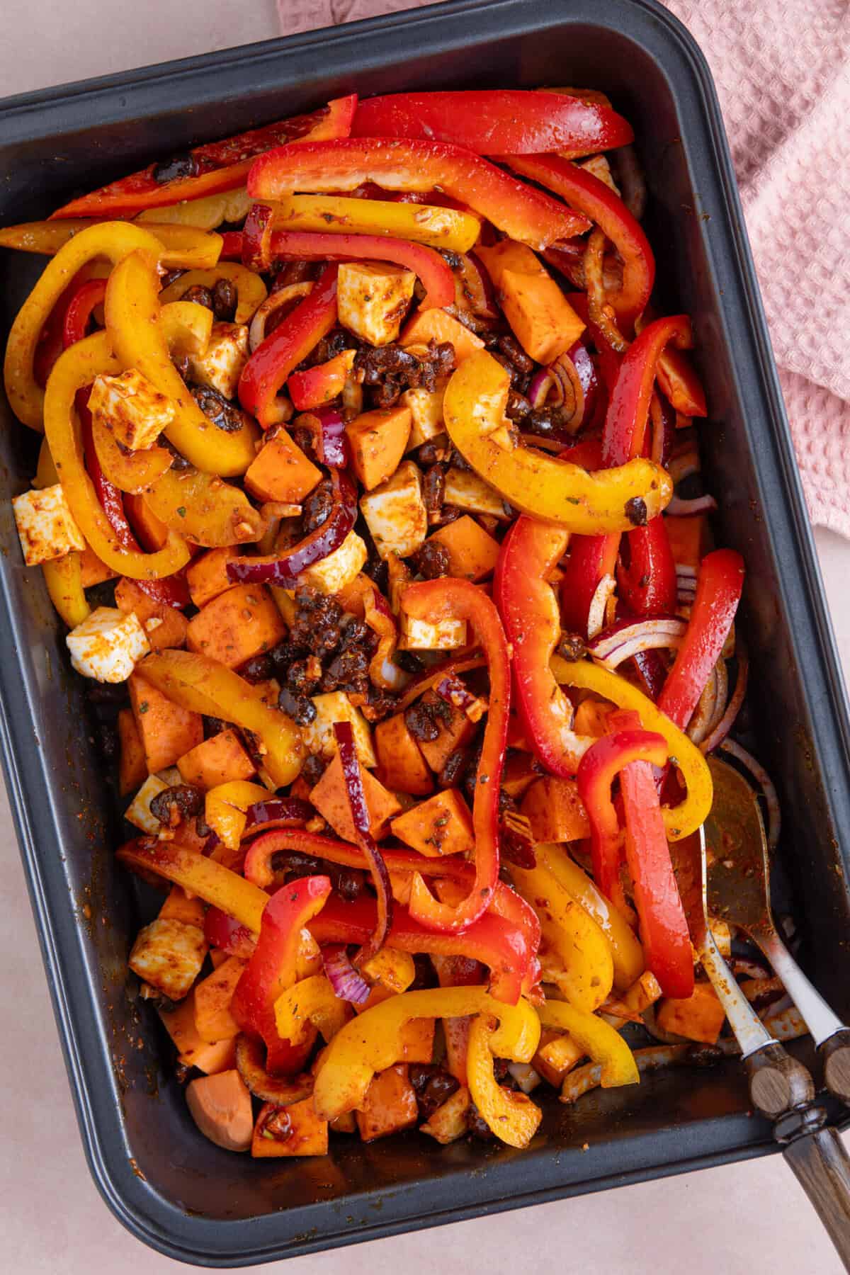 Process shot for halloumi tacos recipe showing the halloumi taco ingredients mixed into the marinade before baking.