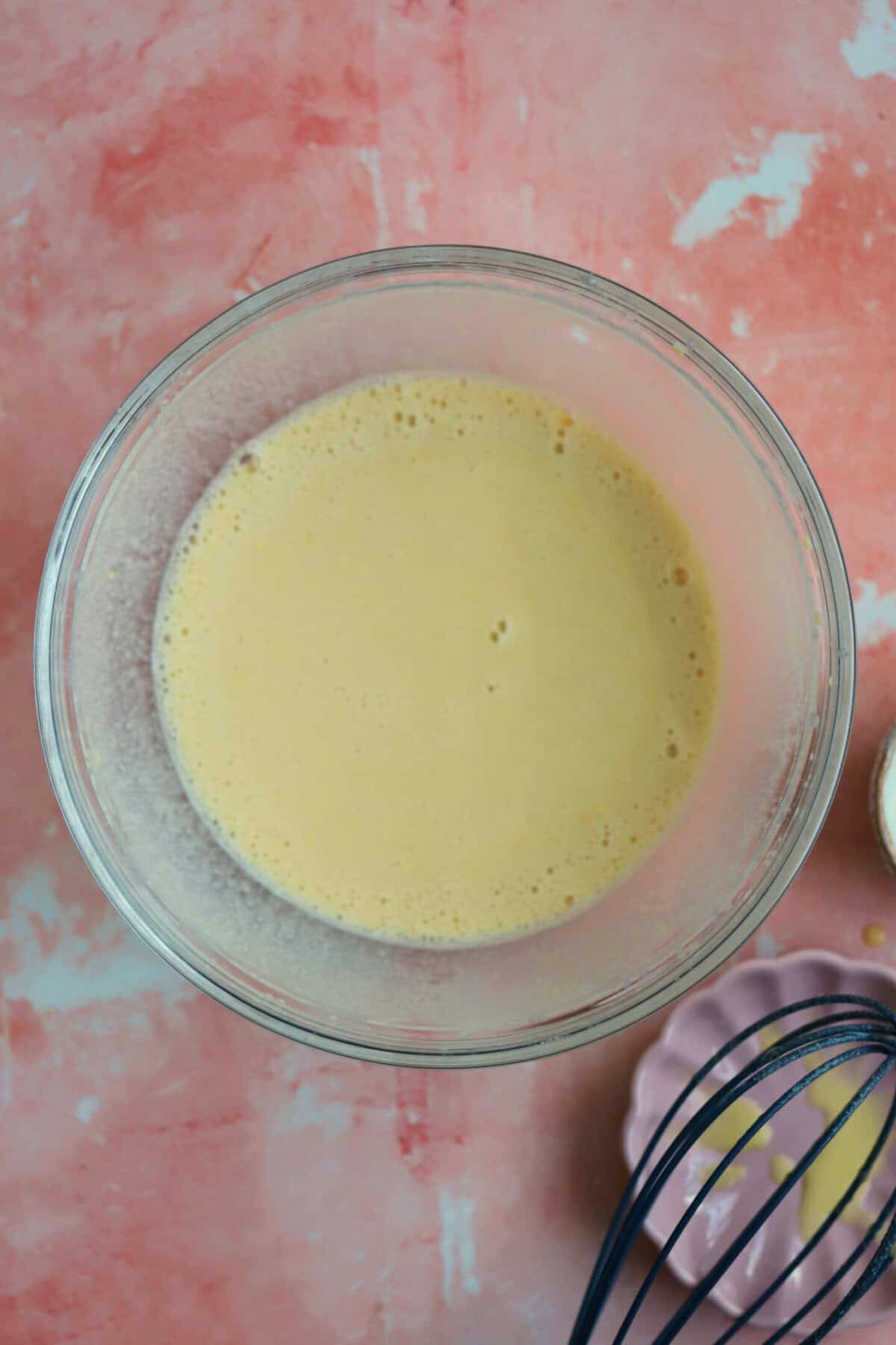 Process shot of gluten free socca recipe showing the batter in a bowl.