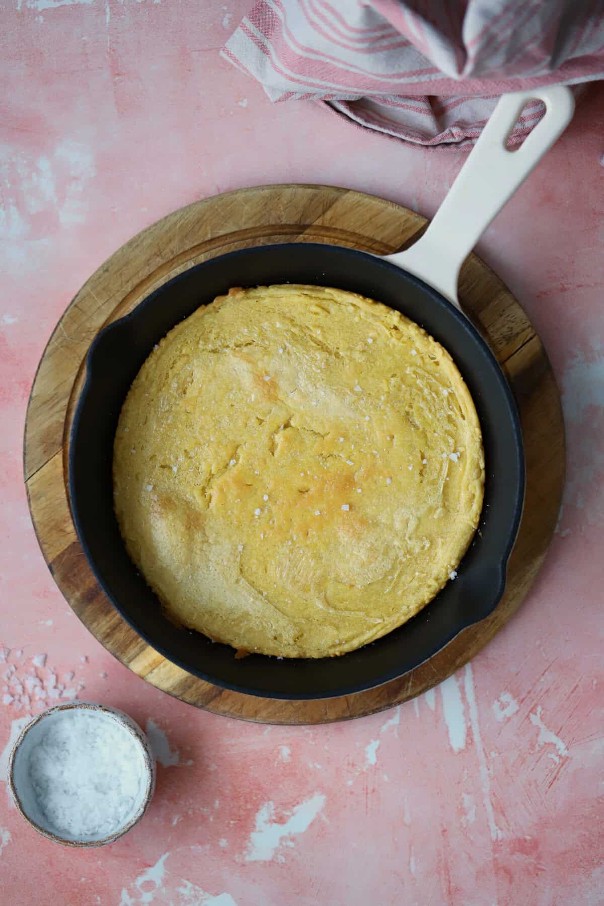 Process shot of gluten free socca recipe showing the baked chickpea flatbread in a pan.
