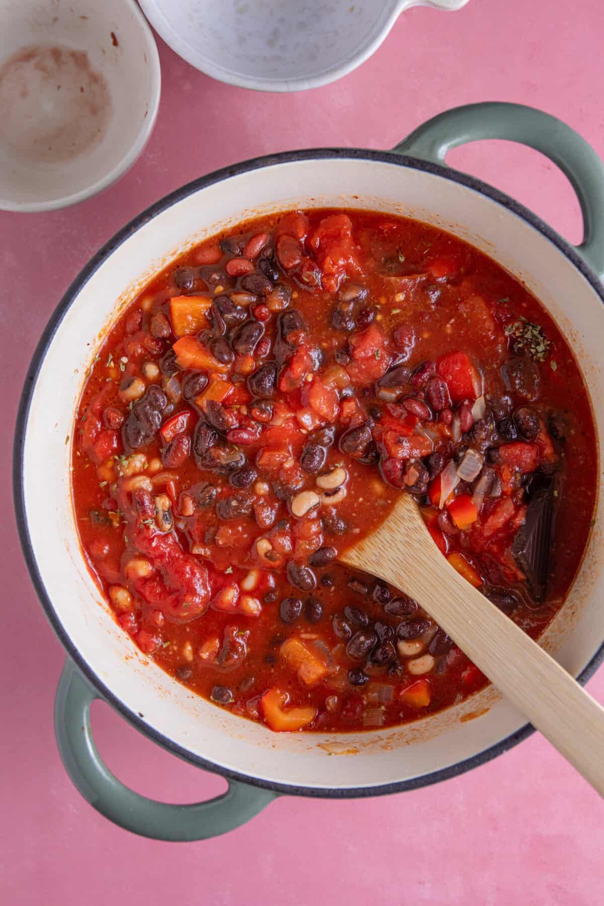 Process shot of a bean chilli recipe showing all the ingredients mixed together in a pan.