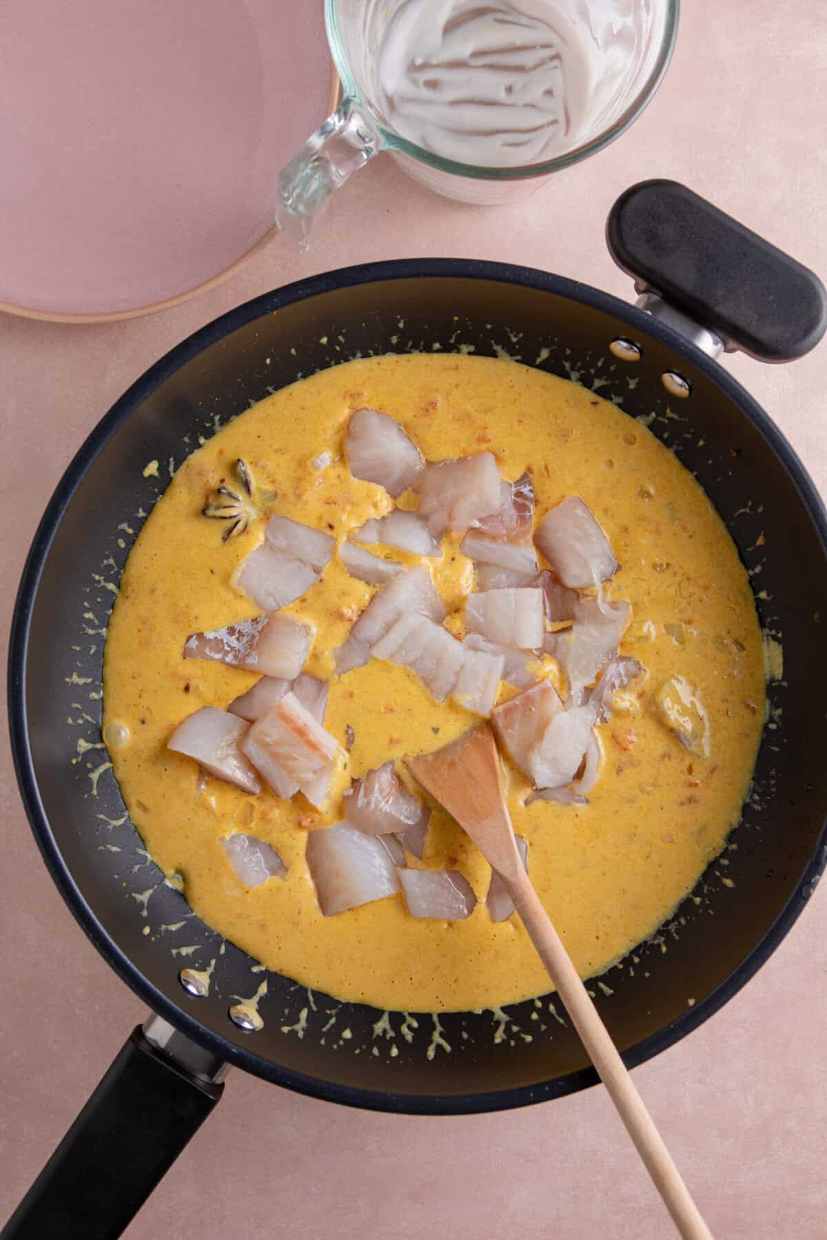 Add the fish and continue to simmer until just cooked through.
